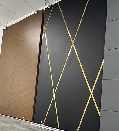 A dark panel design with crossing gold-tone lines, with other door finishes.
