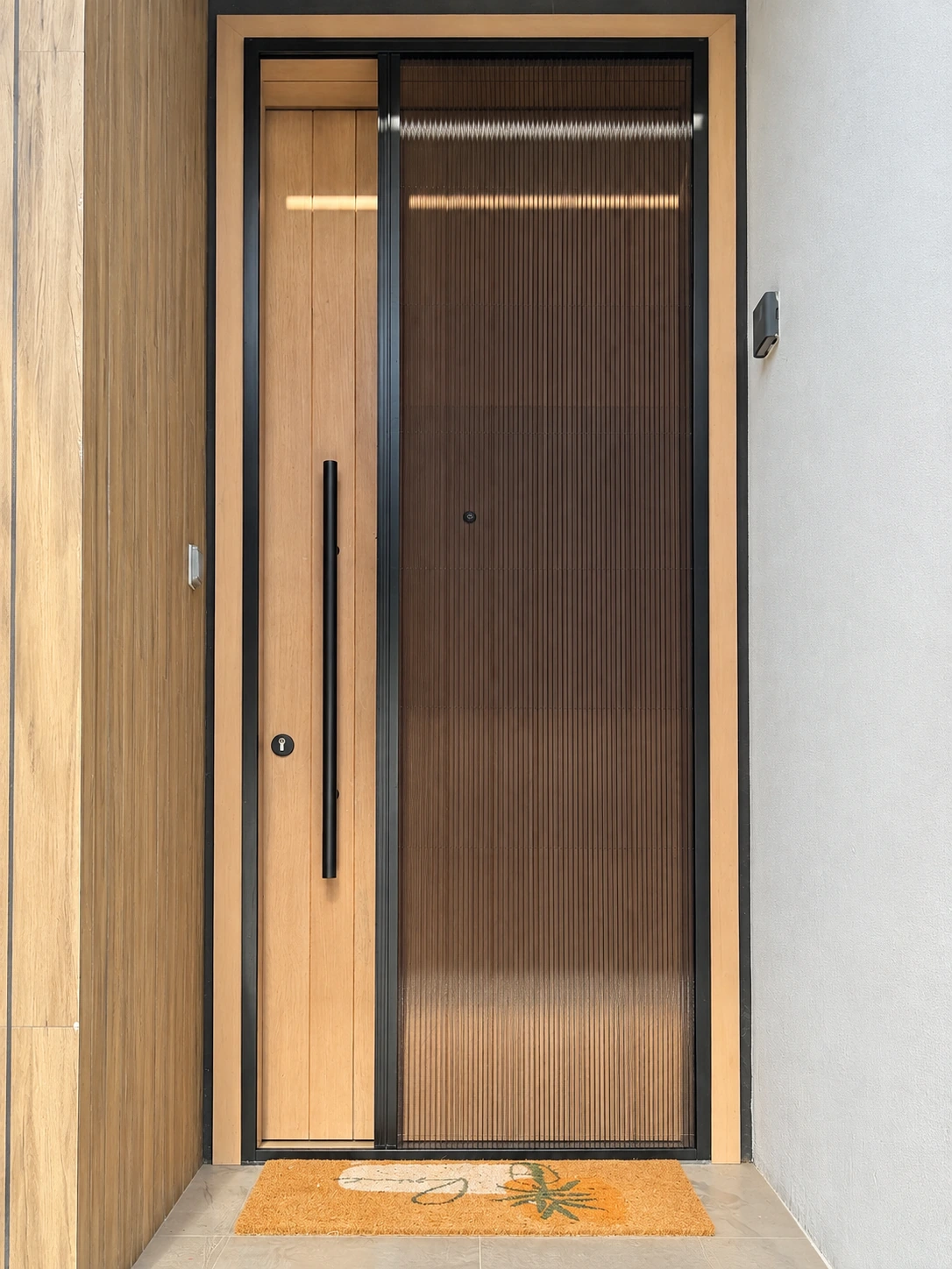 Wood-finish aluminum door with a fly screen door